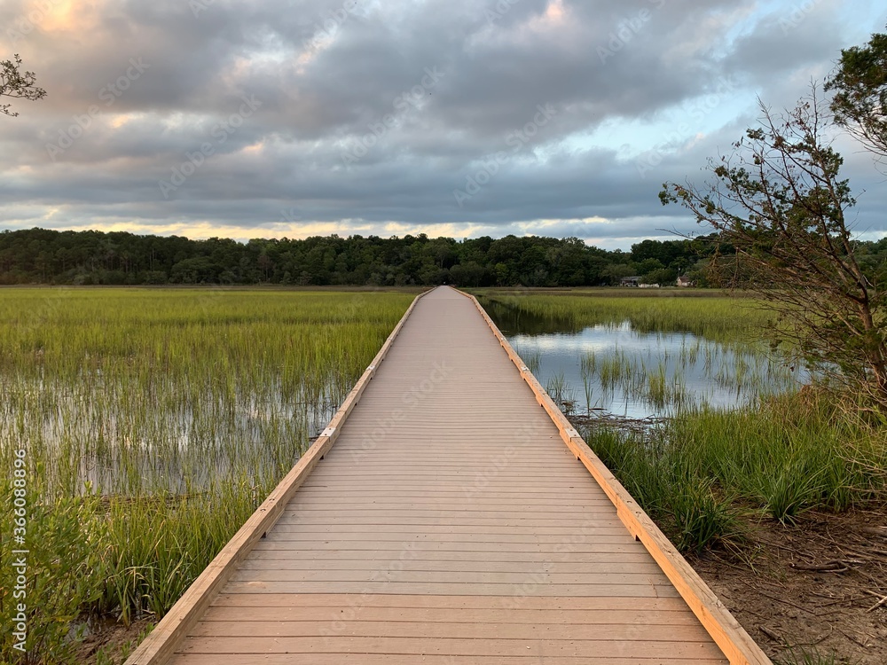 Naklejka premium wooden bridge over lake
