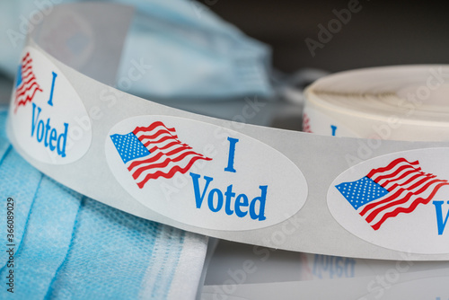 Canvas Print I Voted sticker on protective face mask for in person voting in the presidential