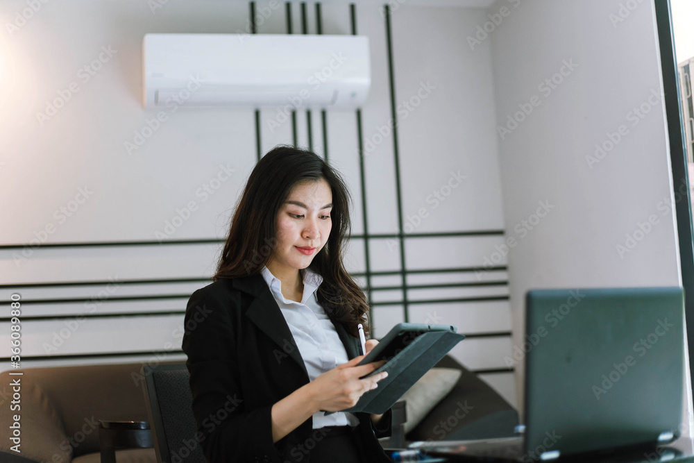 Beautiful young asian woman using tablet pc Beautiful young asian woman using tablet pc