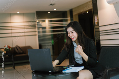  beautiful asian woman success business project with digital laptop computer happy and relax at workspace