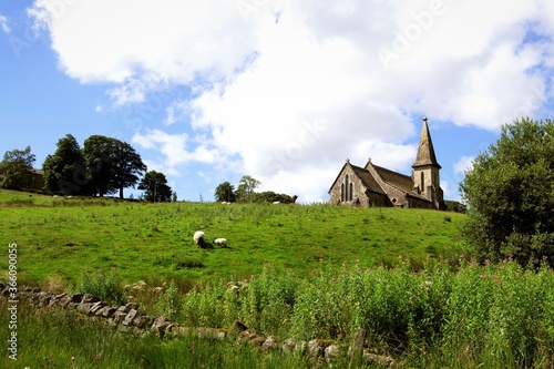Rural landscape with church and trees, in Fewston, North Yorkshire, England. photo