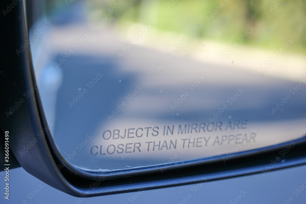 car rear view mirrors carry a warning message