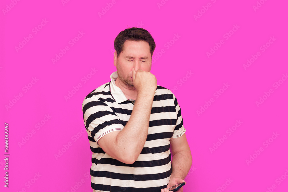 Caucasian man wearing casual striped t-shirt standing over isolated hot pink background shows various gestures. Caucasian man wearing casual striped t-shirt standing over isolated hot pink background shows various gestures.