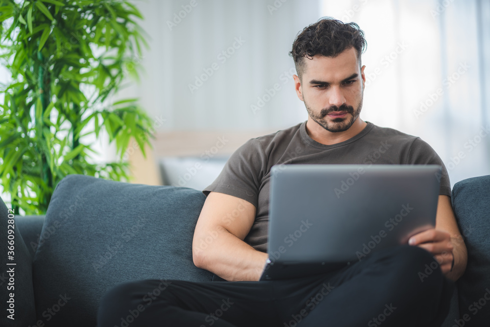 handsome man working from home with laptop, business freelancer concept handsome man working from home with laptop, business freelancer concept