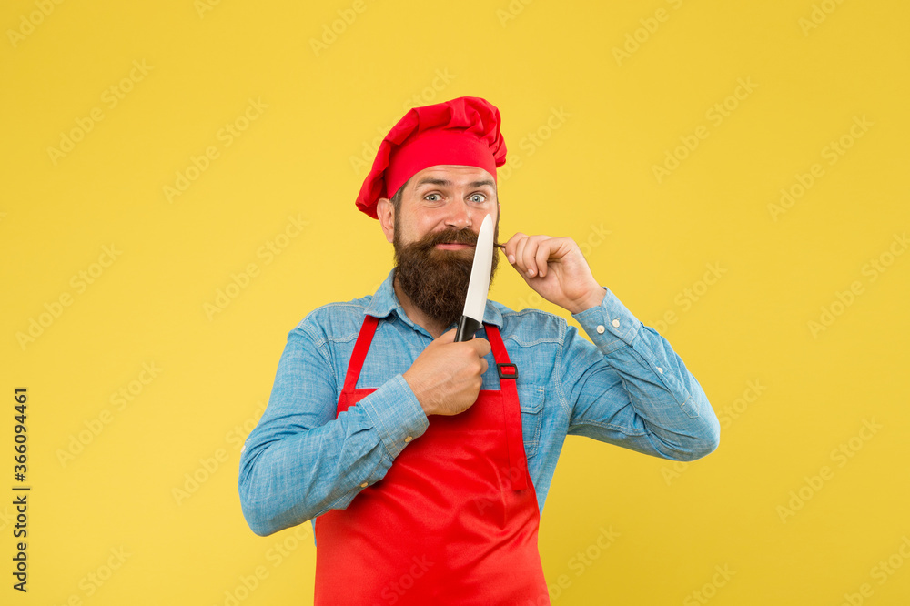 great food and service. brutal butcher in apron. best menu offer. confident bearded happy chef red uniform. Male chef cut with knife. mature hipster with happy face. satisfied bearded chef