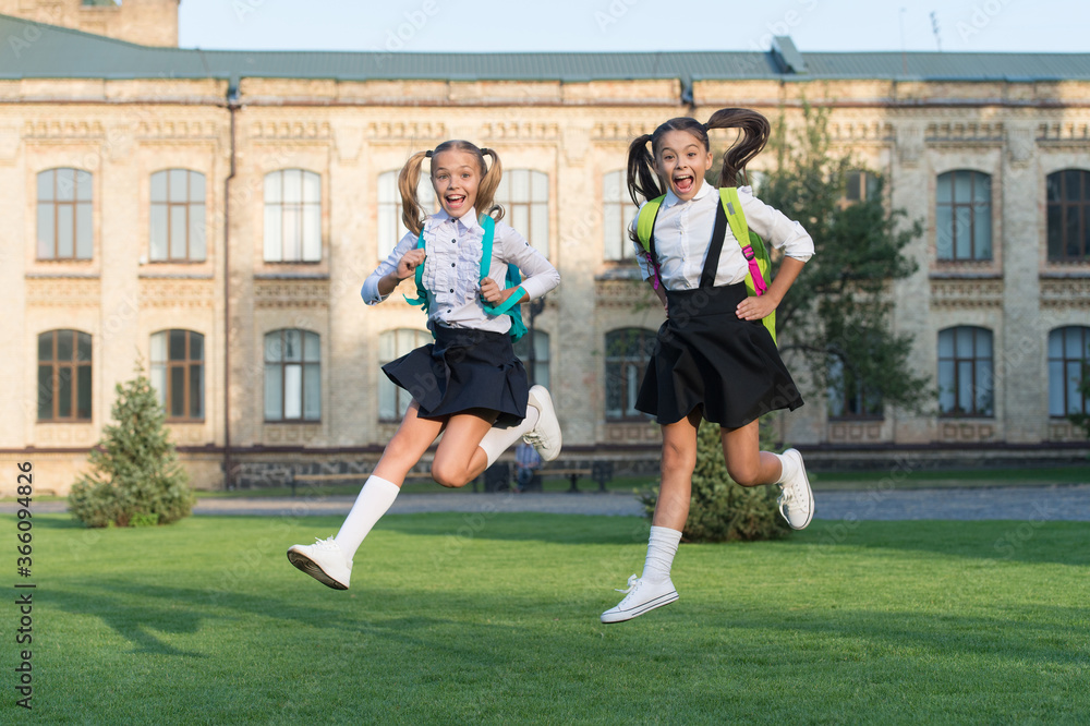 Excited happy girls school uniform running, september reunion concept