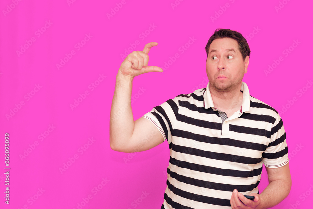 Caucasian man wearing casual striped t-shirt standing over isolated hot pink background shows various gestures. Caucasian man wearing casual striped t-shirt standing over isolated hot pink background shows various gestures.