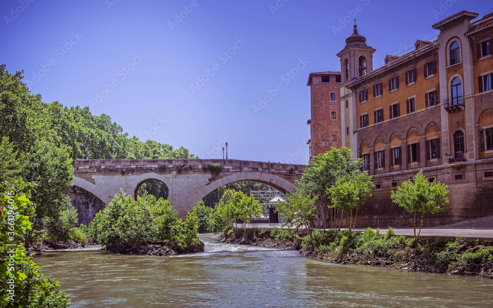 Rome Italy, view of Tiber island, bridge Fabricio and Caetani fortress tower