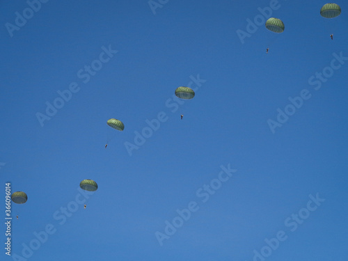 Paratroopers against a blue sky