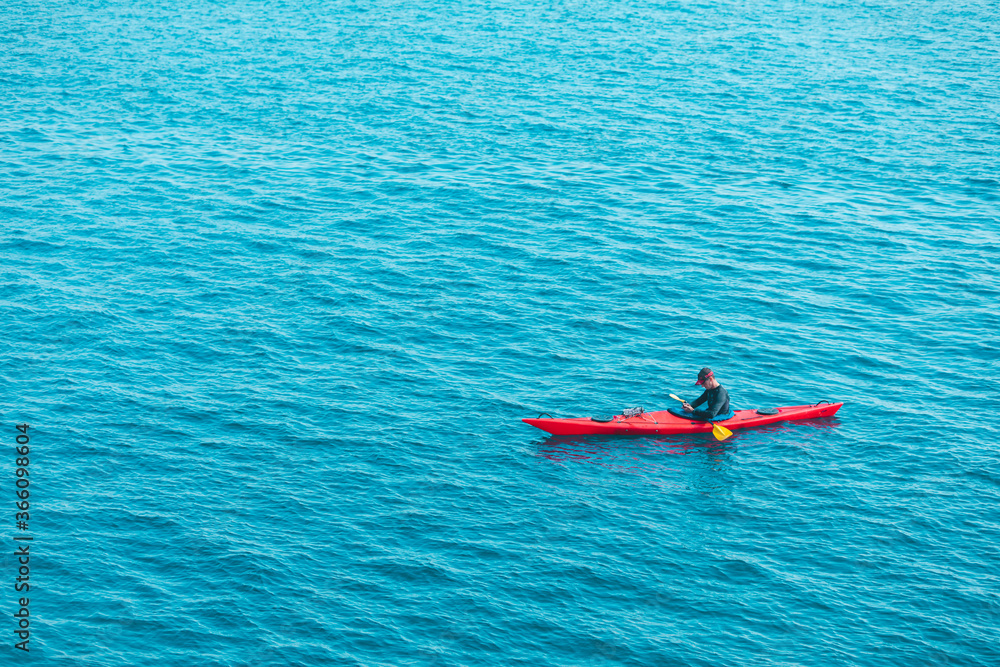 Pula, Croatia - May 31, 2019: people kayaking at clear transparent sea water