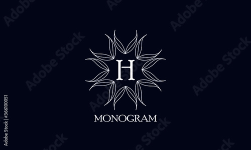 Creative monogram design with letter H on a black background. Sample logo for antiques, restaurant, cafe, boutique, hotel, heraldry and jewelry.