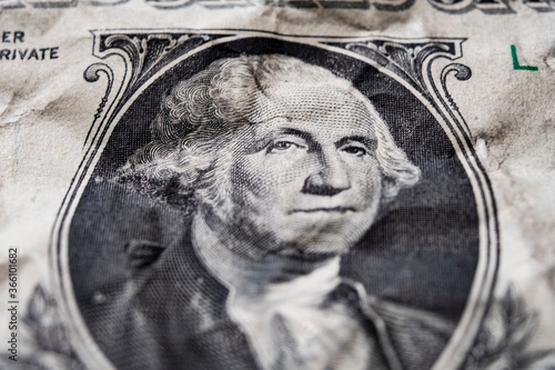 Portrait of George Washington on a mint 1 dollar bill close-up