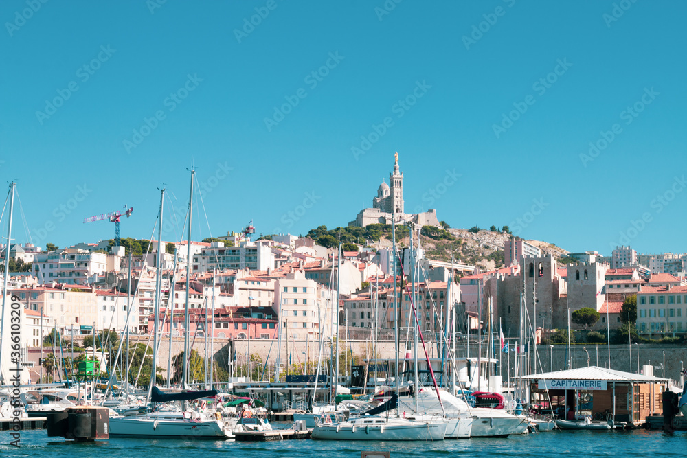 Panoramic view of boats moored in the Old Port of Marseille. It has been the natural harbor of the city since antiquity and is now the main popular place in Marseille. 