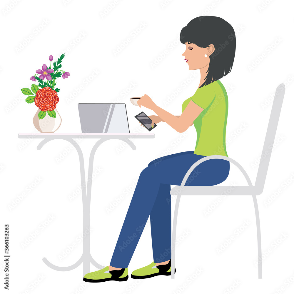 Woman working on laptop in cafe