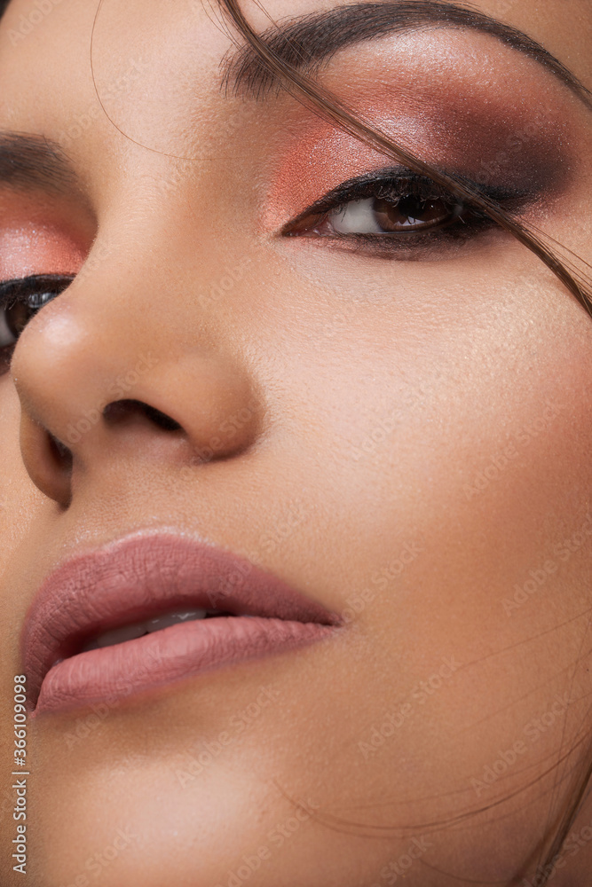 Fototapeta premium detail of a face with professional single-tone makeup and hair, studio