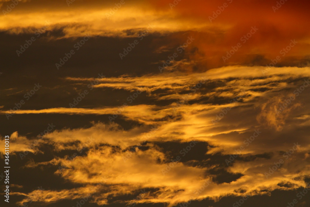 Colorful cloud patterns with golden hour light. Colorful cloud patterns with golden hour light.