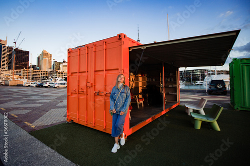 girl posing near library in cargo