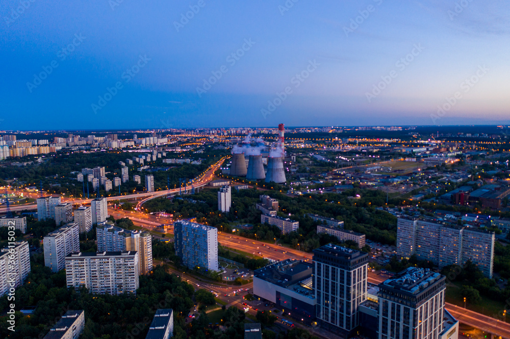 Obraz premium panoramic views of the city infrastructure in the evening filmed from a drone