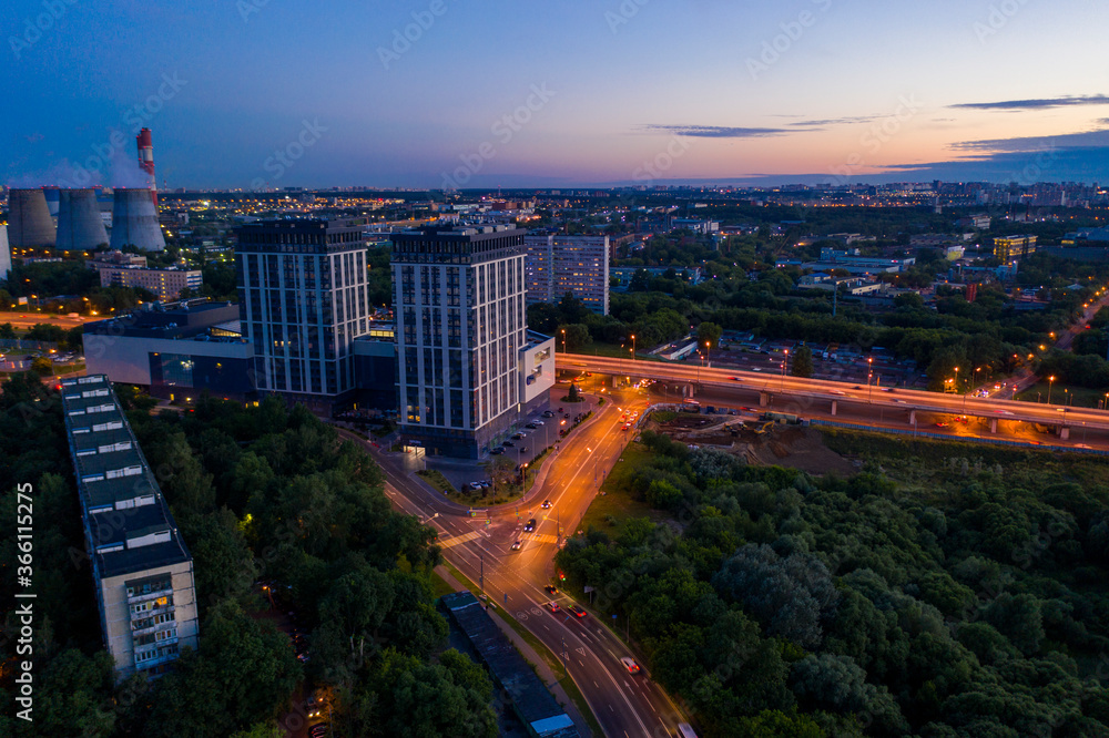 Fototapeta premium panoramic views of the city infrastructure in the evening filmed from a drone
