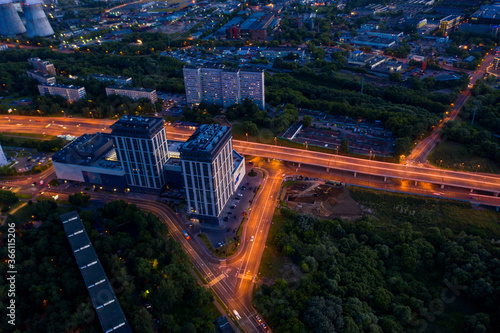 panoramic views of the city infrastructure in the evening filmed from a drone