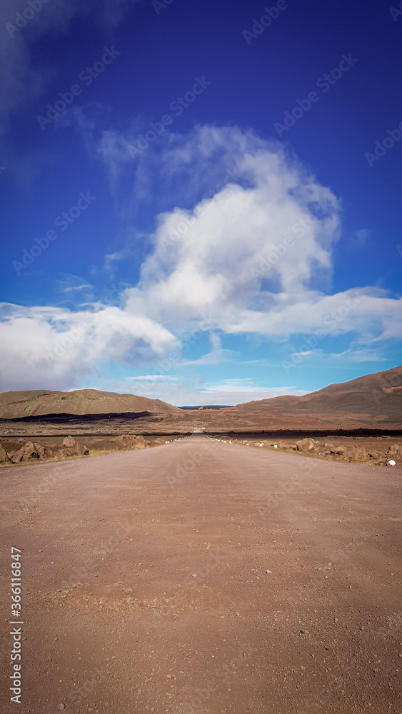 Road to the desert landscape with blue sky in Reunion Island