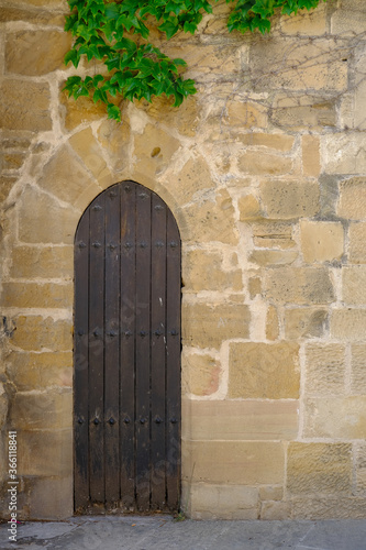 Antique door in stone wall