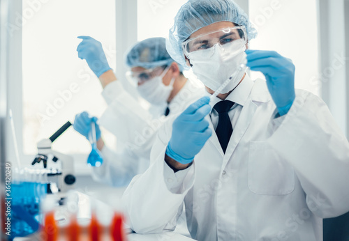 background image of a laboratory assistant in a medical laboratory