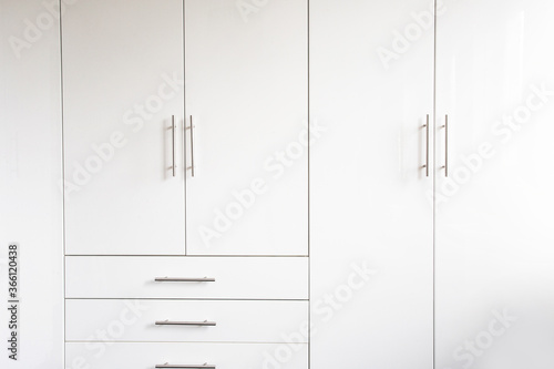 White luxury cupboard doors modern design, closet doors retro background texture abstract new interior photo