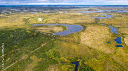 Landscape of the forest-tundra and the sandy river bank, bird's eye view.Arctic Circle, tunda. Beautiful landscape of tundra from a helicopter.