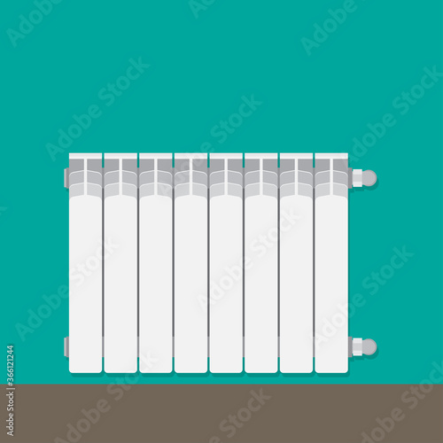 Aluminum central heating battery radiator on wall.