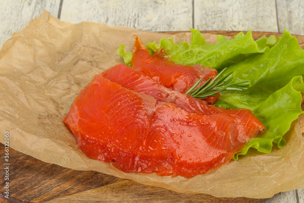 Sliced salmon fillet served rosemary Sliced salmon fillet served rosemary