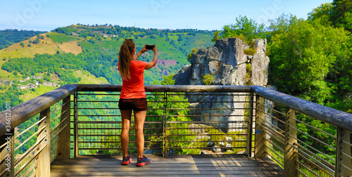 woman taking photo with smartphone- beautiful landscape point of view