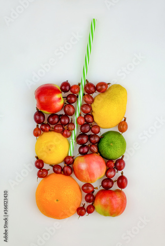 Fototapeta Naklejka Na Ścianę i Meble -  Colorful fruit as form of glass for fresh juice with straw. Summer concept