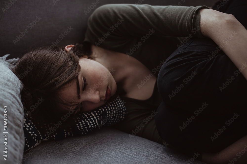 Sad woman on sofa at home Sad woman on sofa at home