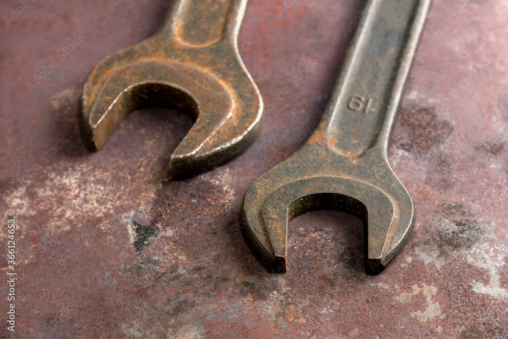 Brutal old wrenches on a metal background Brutal old wrenches on a metal background