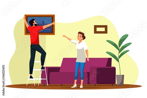 Man hanging picture on wall in new house vector