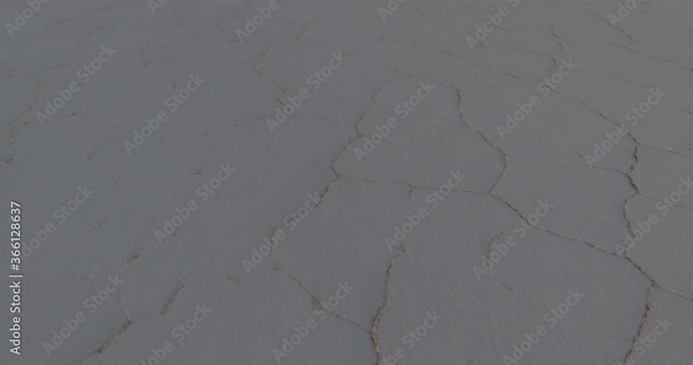 Hexagon Tiles in Uyuni Salt Flat at Sun Rise Travelling Aerial shot Hexagon Tiles in Uyuni Salt Flat at Sun Rise Travelling Aerial shot