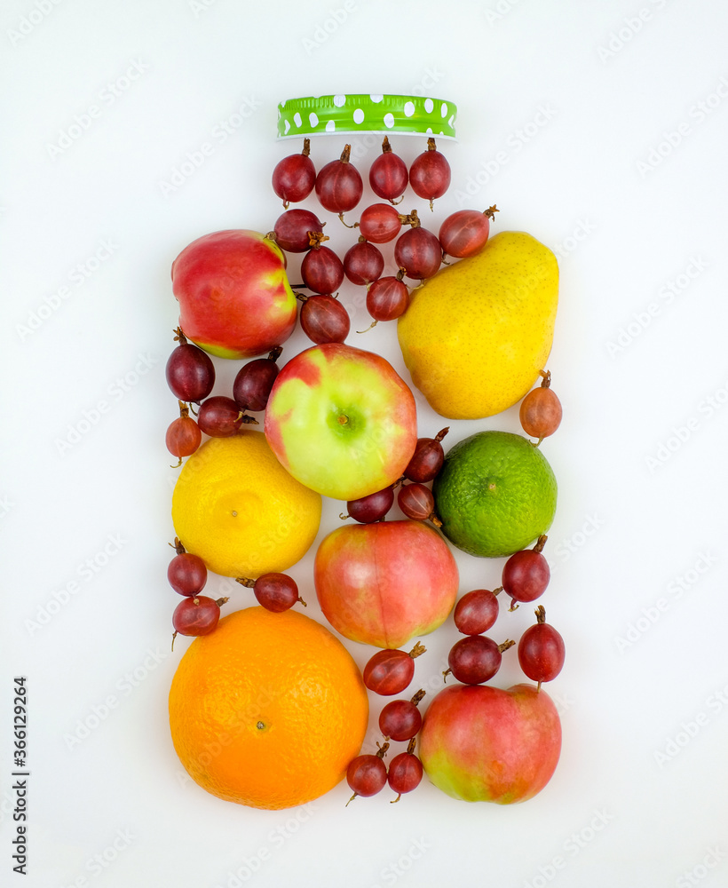 Creative form of fresh fruit in shape of jar on white background. Top view. Healthy eating concept. Creative form of fresh fruit in shape of jar on white background. Top view. Healthy eating concept.