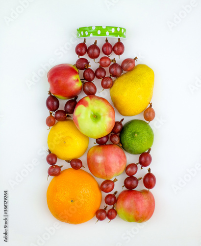 Creative form of fresh fruit in shape of jar on white background. Top view. Healthy eating concept.