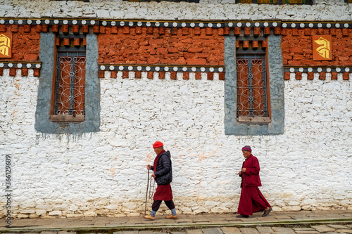 Bhutanese Pilgrims circumnavigate Tamzhing Monastery, Bumthang District, Bhutan photo