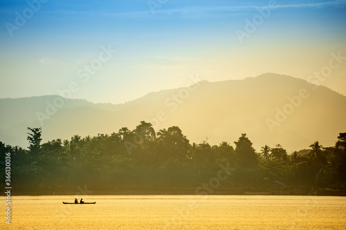 A local fisherman in a traditional canoe, Banda, Maluku, Spice Islands, Indonesia photo