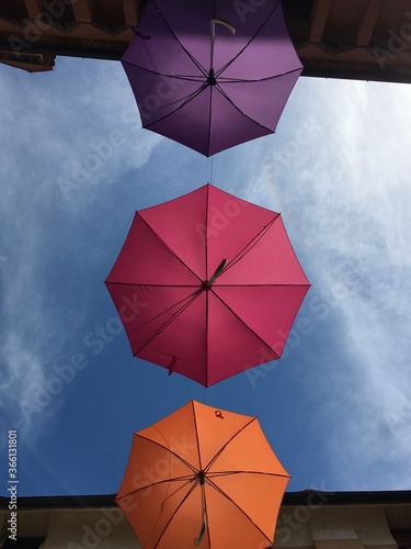 colored umbrellas under the sky  summer  hot sun  colors  pink  orange  purple