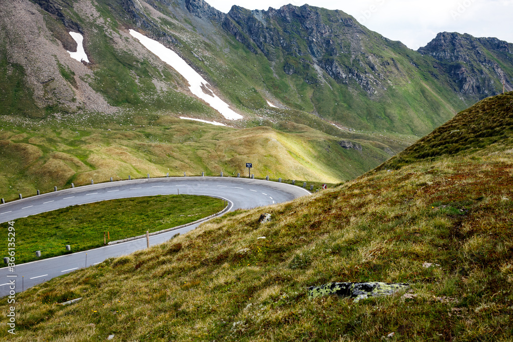 Fototapeta premium spectacular colorful view of mountain landscape with clouds and blue sky at the Grossglockner and the High Alpine Road in the austrian alps