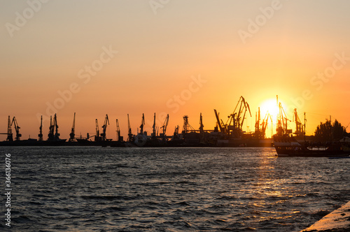 Sunset overlooking the cranes and docks of the port city of Berdyansk, Ukraine