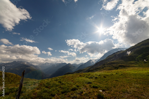 spectacular colorful view of mountain landscape with clouds and blue sky at the Grossglockner and the High Alpine Road in the austrian alps