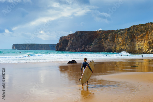 Surfer surfboard woman Portugal beach