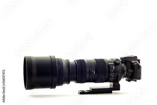 Modern DSLR Camera With Super Telephoto Zoom Lens On White