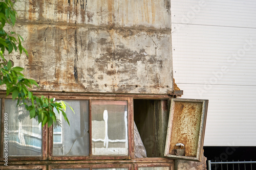 Old wooden window is falling apart in abandoned factory 