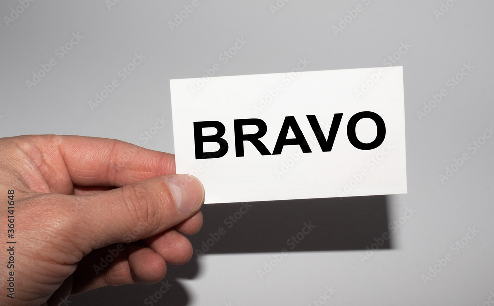 Message on the card BRAVO, in hands of businessman. Message on the card BRAVO, in hands of businessman.