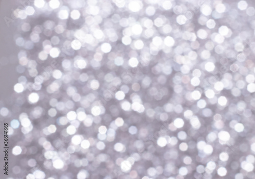 Silver glitter festive background with bokeh lights. Celebration concept for Holidays and anniversary.
